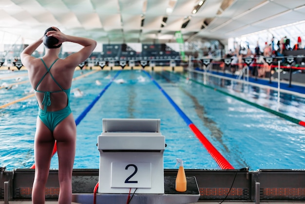 Swimmer in the pool prepares for the competition