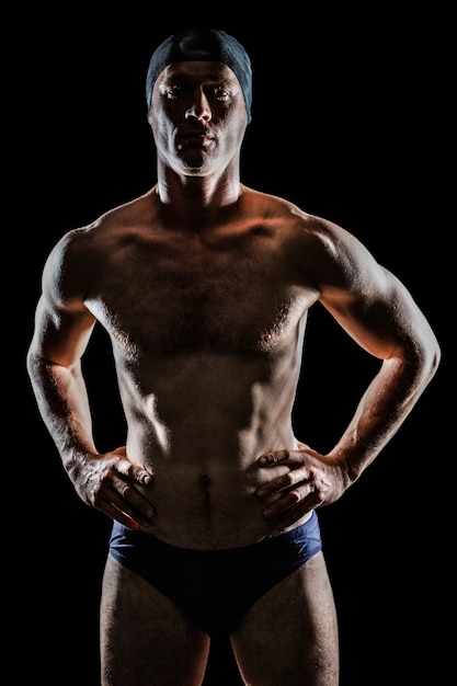 Swimmer standing with hand on hip