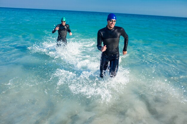 Swimmers running in the ocean