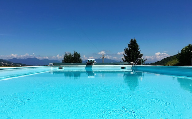 Swimming pool against blue sky