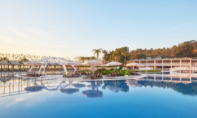 Swimming pool and beach of luxury hotel.