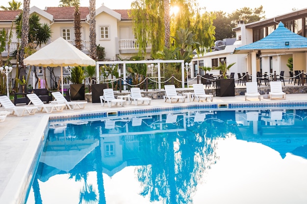 Swimming pool of luxury hotel. swimming pool in hotel with metal ladder.