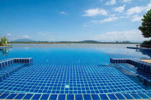 Swimming pool near Khong river with blue sky Chiangsan in Chiangrai Thailand