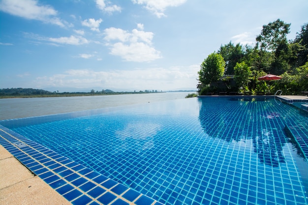 Swimming pool near Khong river with blue sky Chiangsan in Chiangrai Thailand