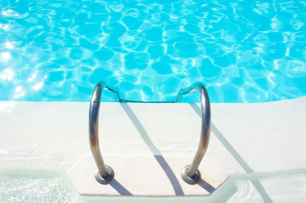 Swimming pool stairs and clear water