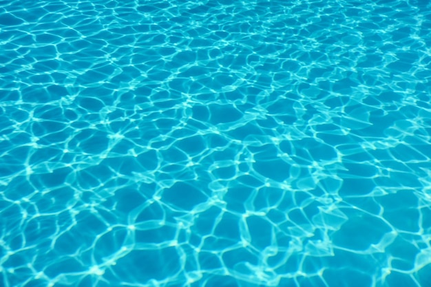 Swimming pool water sun reflection background. Ripple Water.