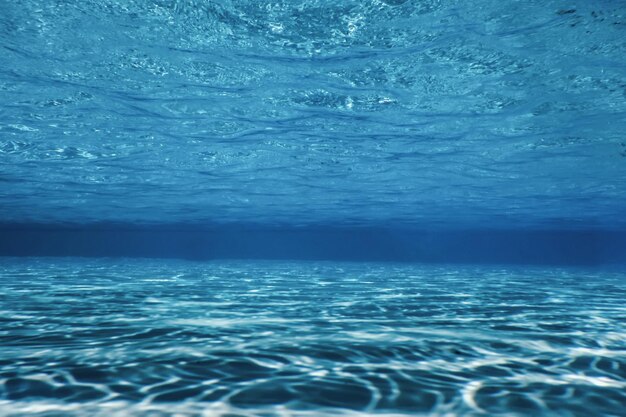 Swimming pool water sun reflection background. Ripple Water.