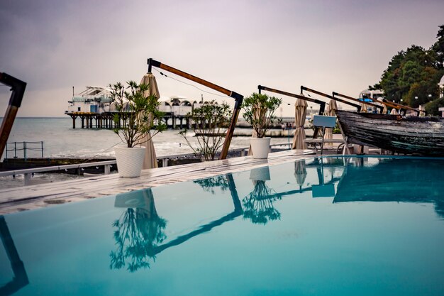 Swimming pool with blue water on the beach