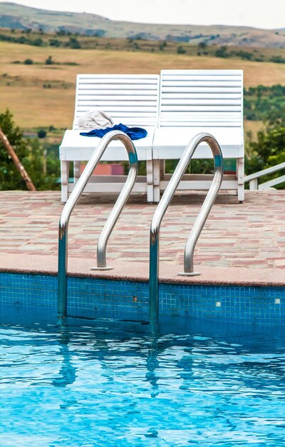 Swimming pool with blue water and stairs