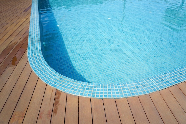 Swimming pool with fake wood flooring stripes summer vacation