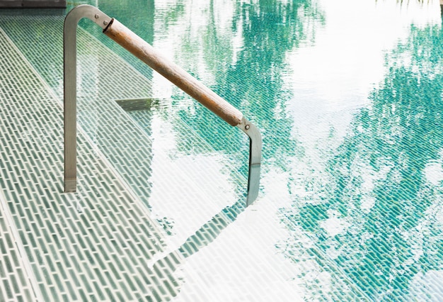 Swimming pool with ladder