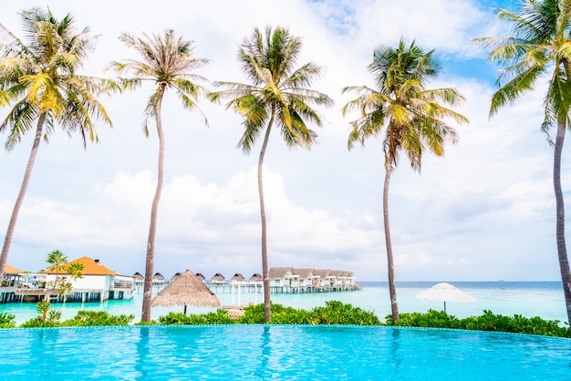 swimming pool with sea beach in Maldives