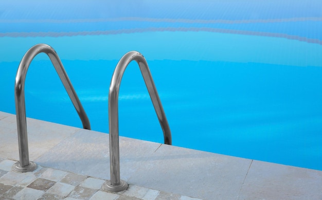 Swimming pool with stair and clean water outdoors