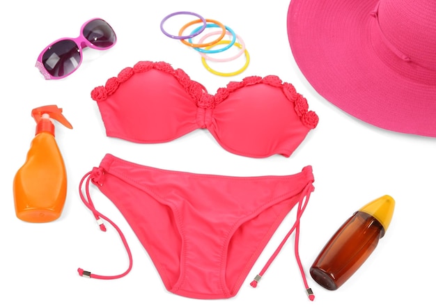 Swimsuit and beach items isolated on white