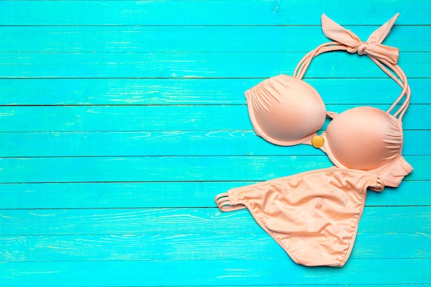 Swimsuit on wooden table