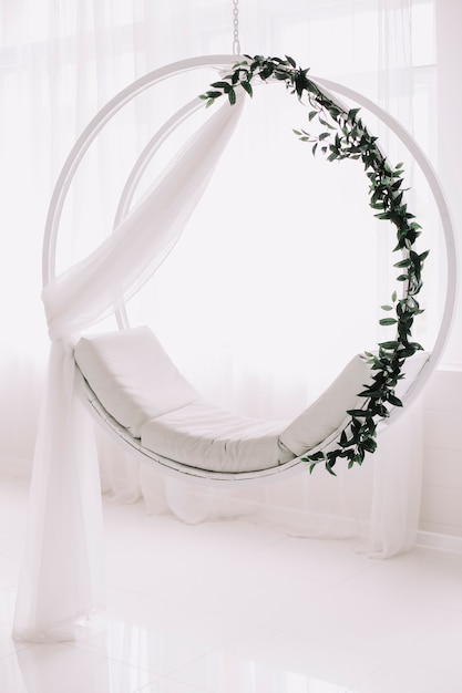 Photo swing decorated with flowers