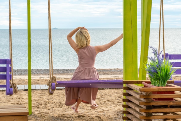 Swing happy sea beach travel summer woman leisure thailand asia from traveler phuket for tropical