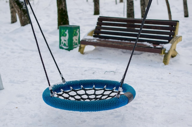 Swing in playground during winter