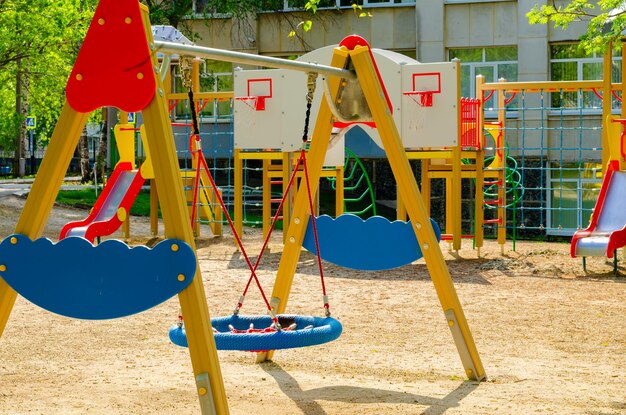 Swing on the playground on a summer day.