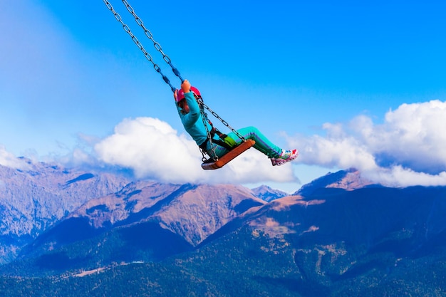 Photo swings above clouds rosa peak sochi