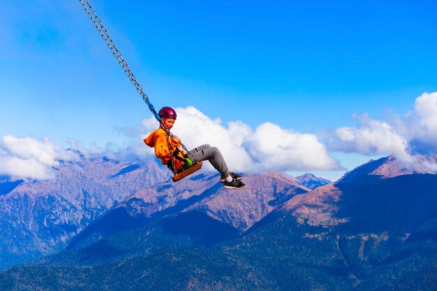 Photo swings above clouds rosa peak sochi