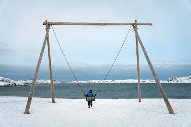 Swings on coast of the Arctic ocean the Kola Peninsula Teriberka Russia