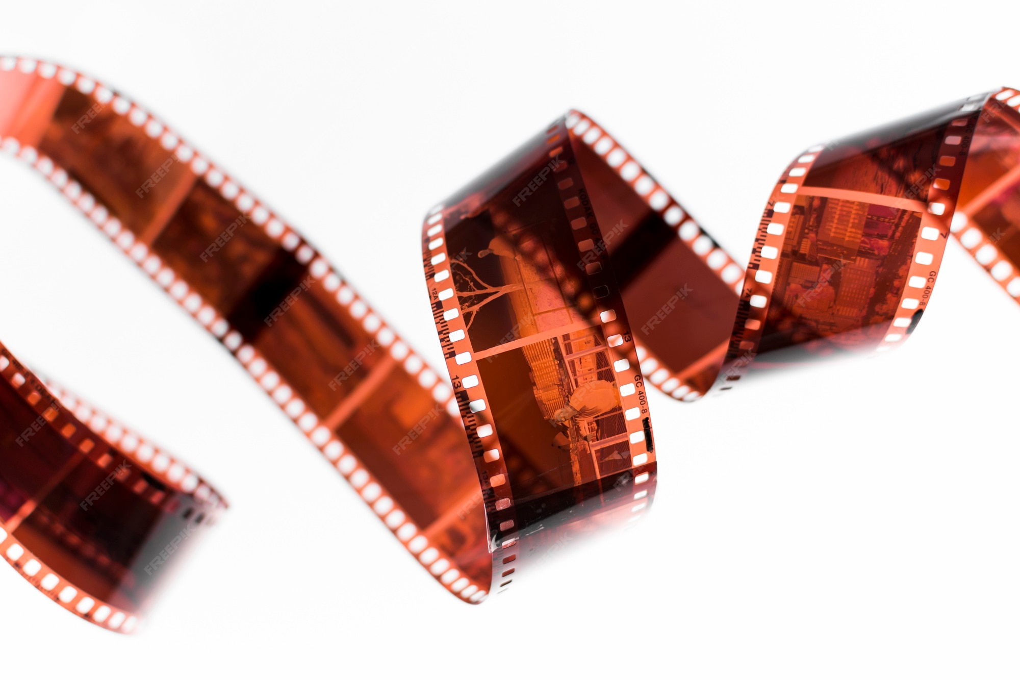 Premium Photo Swirl negatives film isolated on white backdrop
