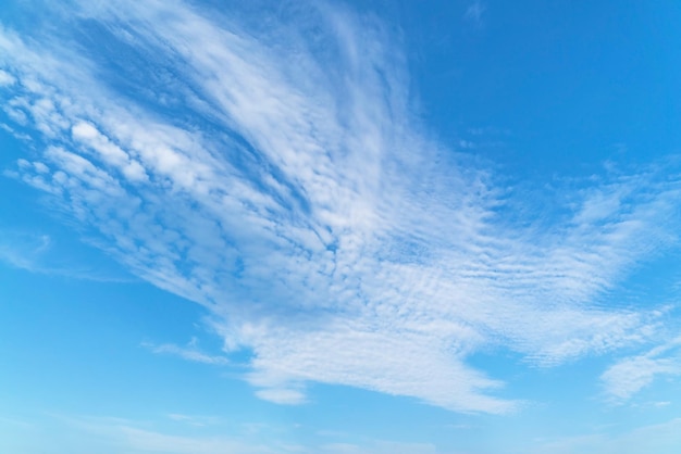 Swirling cirrus clouds in a blue sky