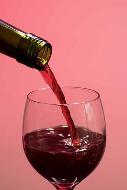 Swirling wine in the glass with pink