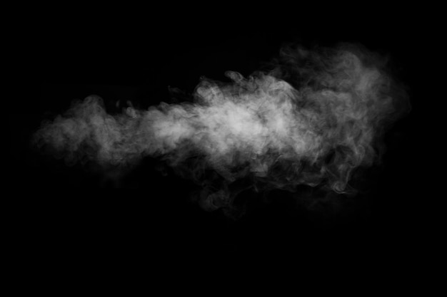 Photo swirling wriggling smoke steam isolated on a black background for overlaying on your photos fragment of horizontal steam