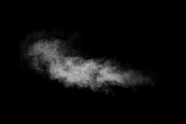 Swirling wriggling smoke steam isolated on a black background for overlaying on your photos Fragment of vertical steam Abstract smoky background design element