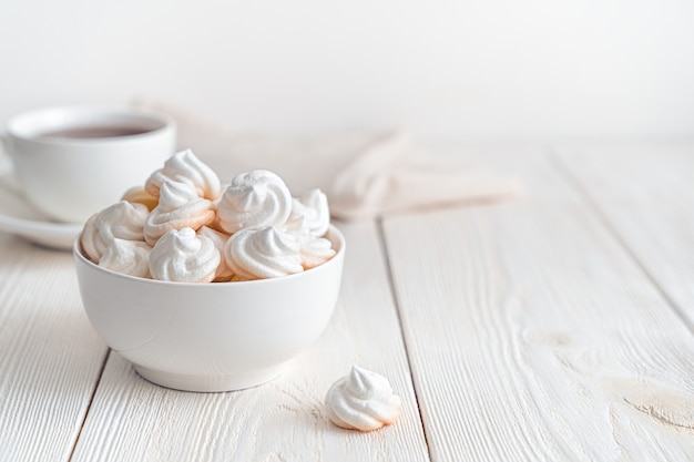 Swiss meringues on a soft light background. Side view, horizontal with space to copy.