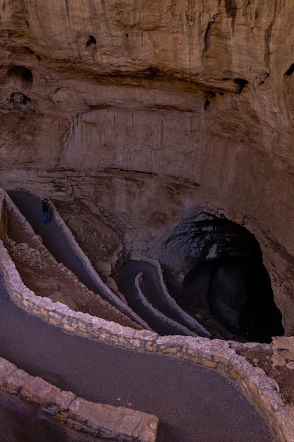 Switchback footpath winds into natural opening of Carlsbad Caverns.