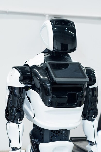 Photo switched off humanoid robot with an interactive display and a screen instead of a face that can display emotions