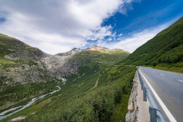 Switzerland Alps Summer In the mountains Beautiful mountain serpentine on the slopes of the mountains from which snow does not leave even in summer