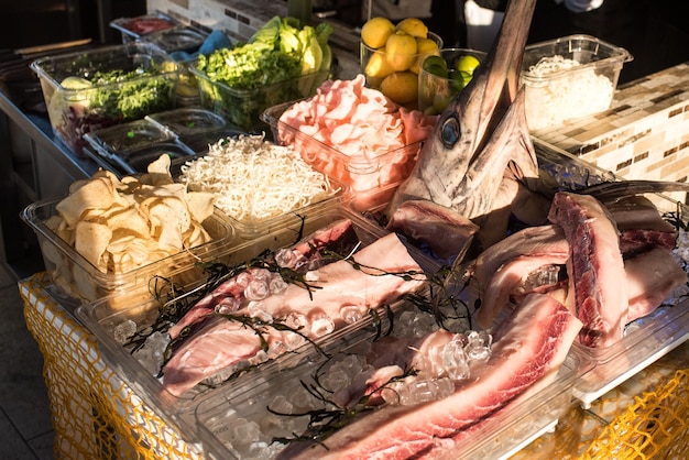 A sword fish on table in open air restaurant