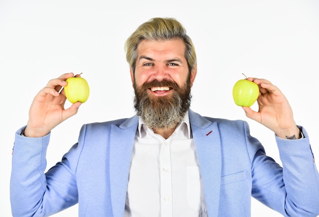 Symbol of creative idea vitamin and health dieting fruit harvest industry Effective successful business Businessman in his office holding an apple time for business lunch healthy food concept