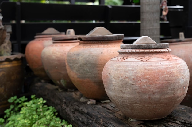 Symbol of several jars with wooden lids on top