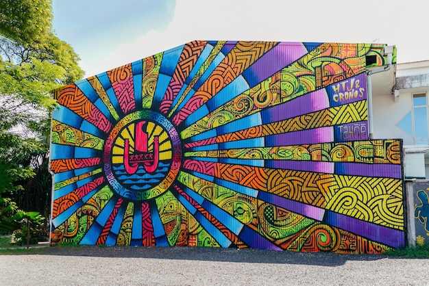 Symbolic drawing in a tropical city park with palm trees in French Polynesia