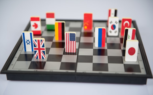 Symbols of the countries on the chess Board. Conceptual photo, political games.