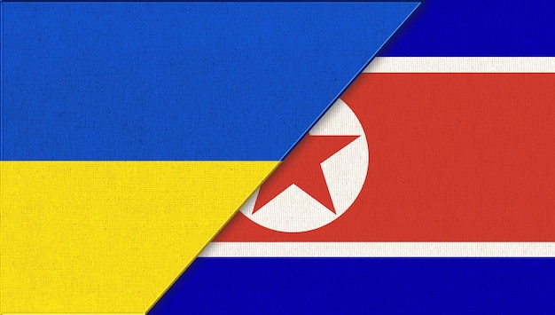 Photo symbols of ukraine and north korea flags of european and asiatic country