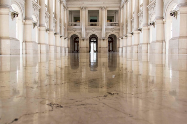 symmetrical view of corridor of a historical building