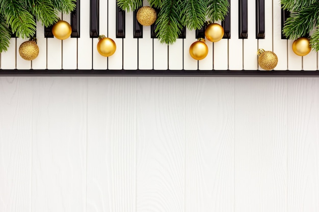 Synthesizer with Christmas decor toys and spruce branch