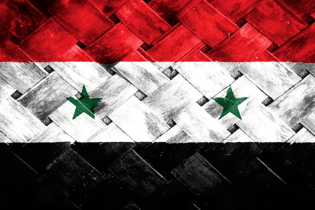 Syria flag screen on wicker wood background