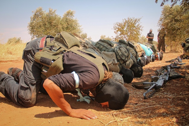 Syrian opposition fighters performing the prayer the soldiers perform the prayer