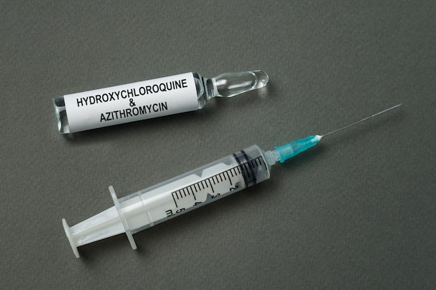 Syringe and ampoule with label Hydroxychloroquine and azithromycin.