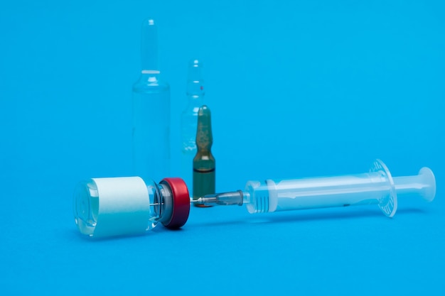 A syringe and ampoules. Vaccination