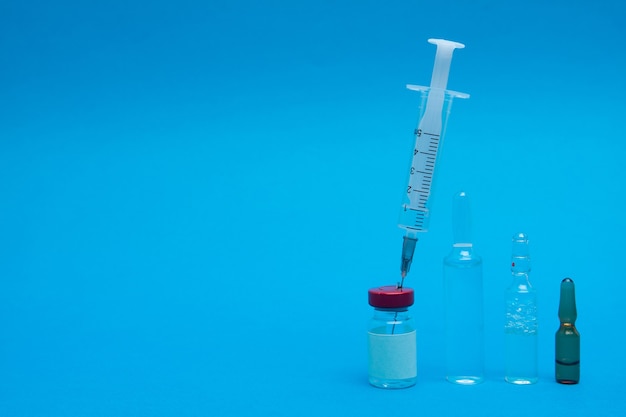 A syringe and ampoules. Vaccination