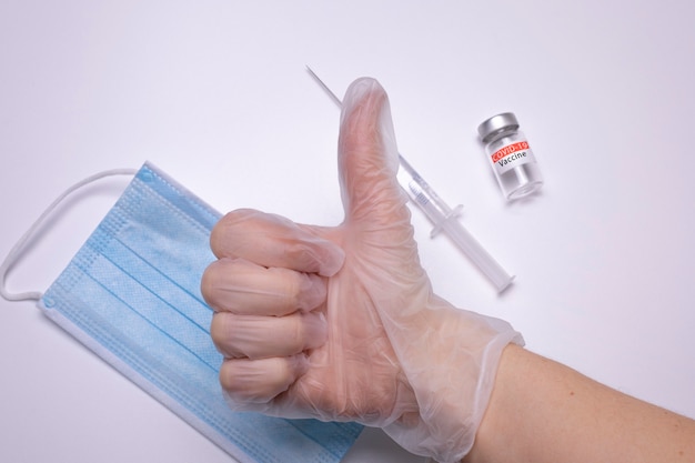 Syringe and bottle with vaccine for coronavirus cure. Concept of corona virus treatment, injection, shot and clinical trial during pandemic.