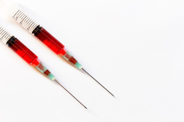 Syringe closeup isolated on white background